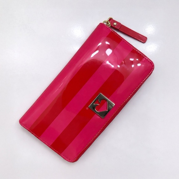 kate spade Handbags - Kate Spade Striped Pink Zip-around Wallet